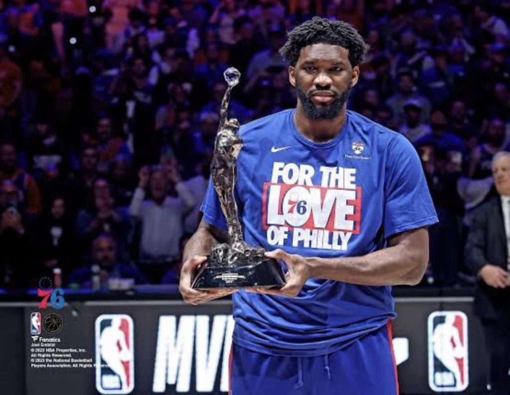 Jeol Embiid receiving the MVP award