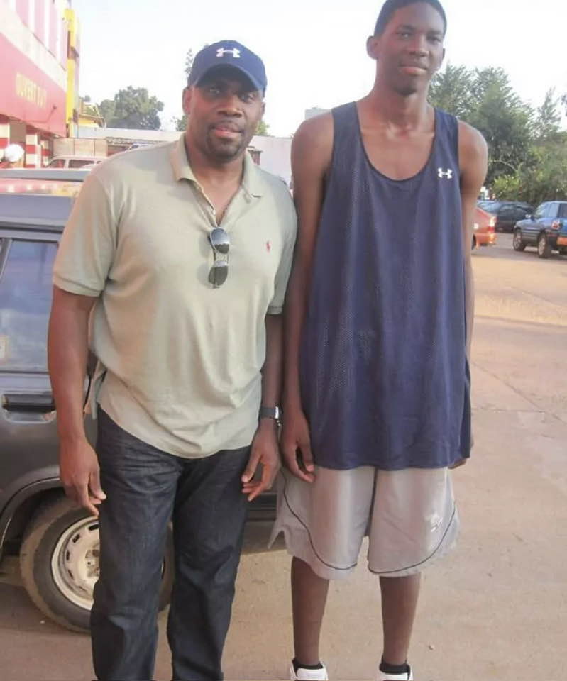 Mr Joe Touomou with the teenage prodigy, Joel Embiid in the dusty streets of Yaoundé in 2012